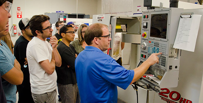 Norco College Associate Professor of Manufacturing Technology Paul VanHulle with students in the classroom