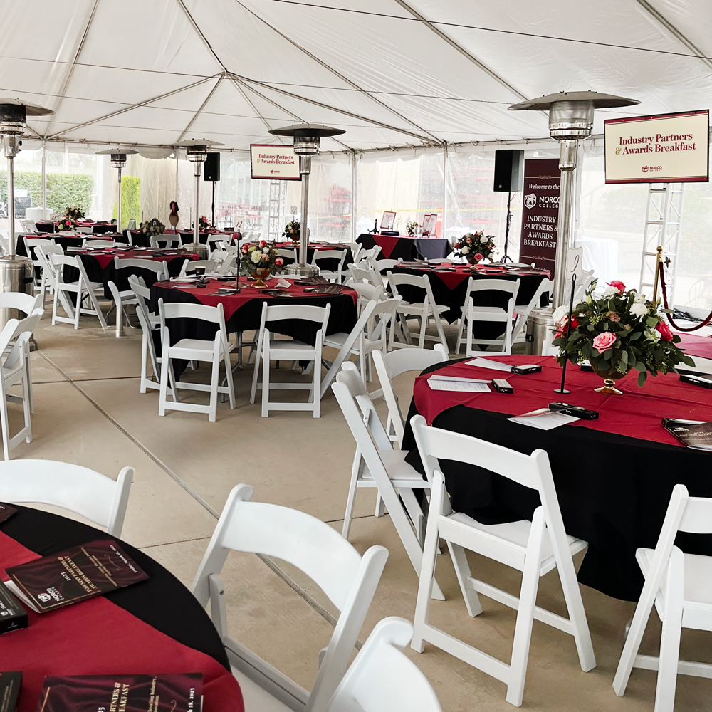 Industry Partners Breakfast tables and chairs inside the tent