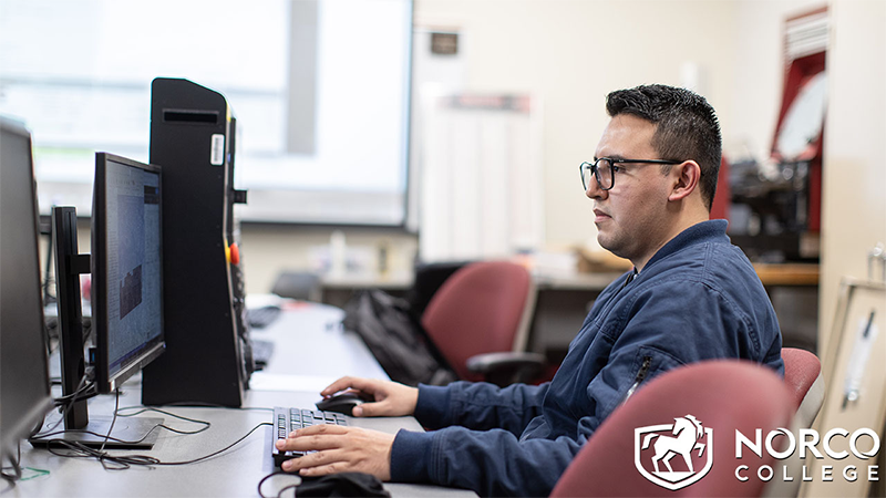 Career and Technical Education (CTE) student working on the computer.