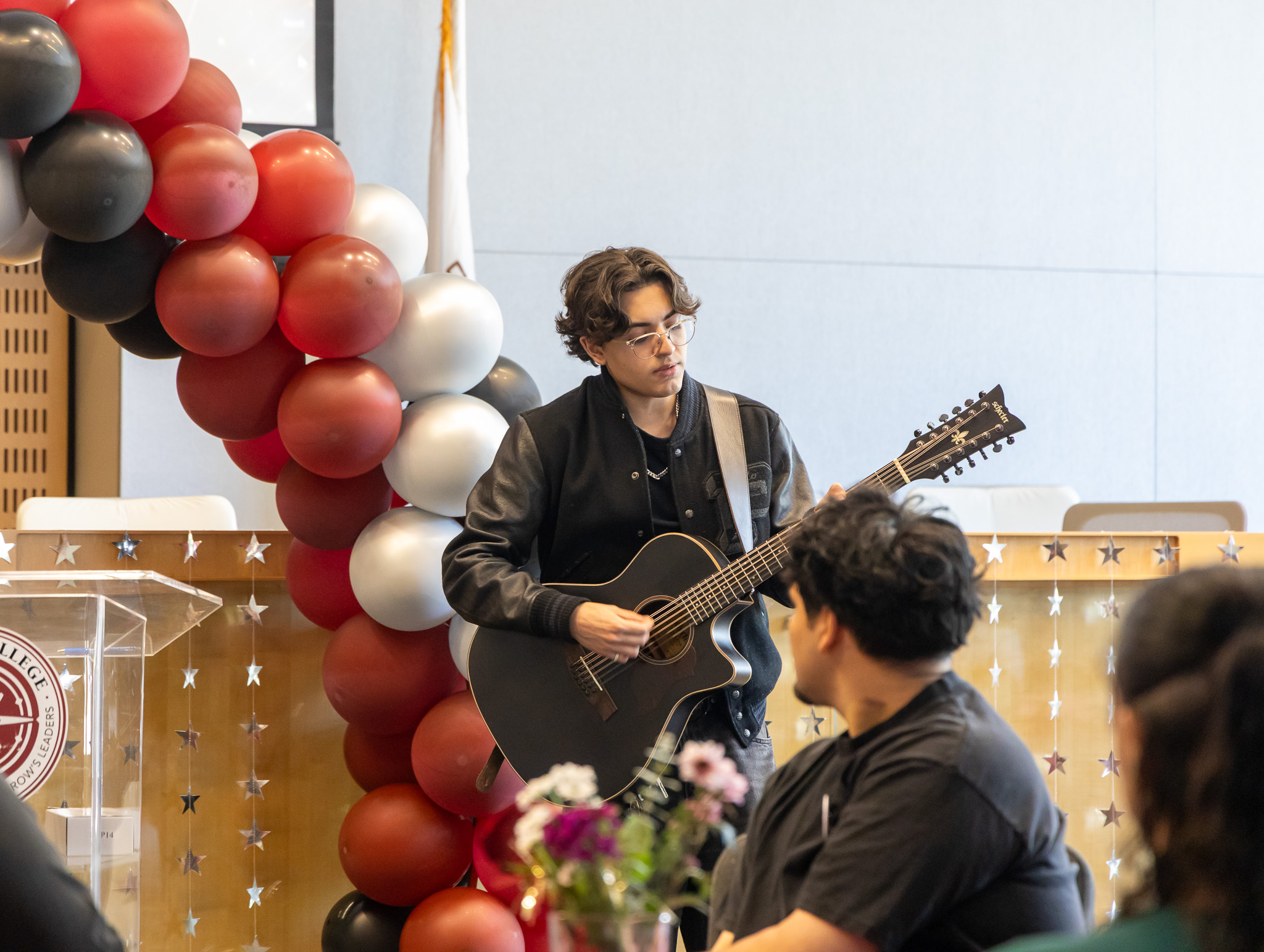 A student guitarist performs a special musical tribute during the celebration honoring Kasey Boyer as Norco College’s 2026 Classified Professional of the Year