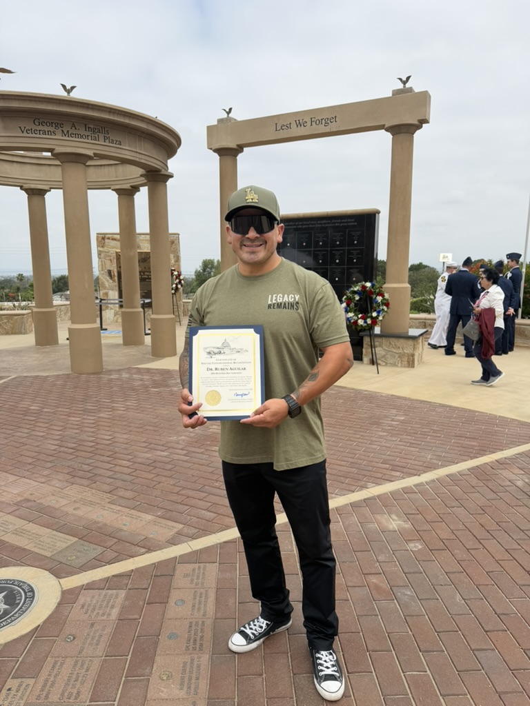 Ruben Aguilar, Ed.D. standing with the certificate he received at the City of Norco Memorial Day event. Ruben Aguilar, Ed.D. standing with the certificate he received at the City of Norco Memorial Day event.