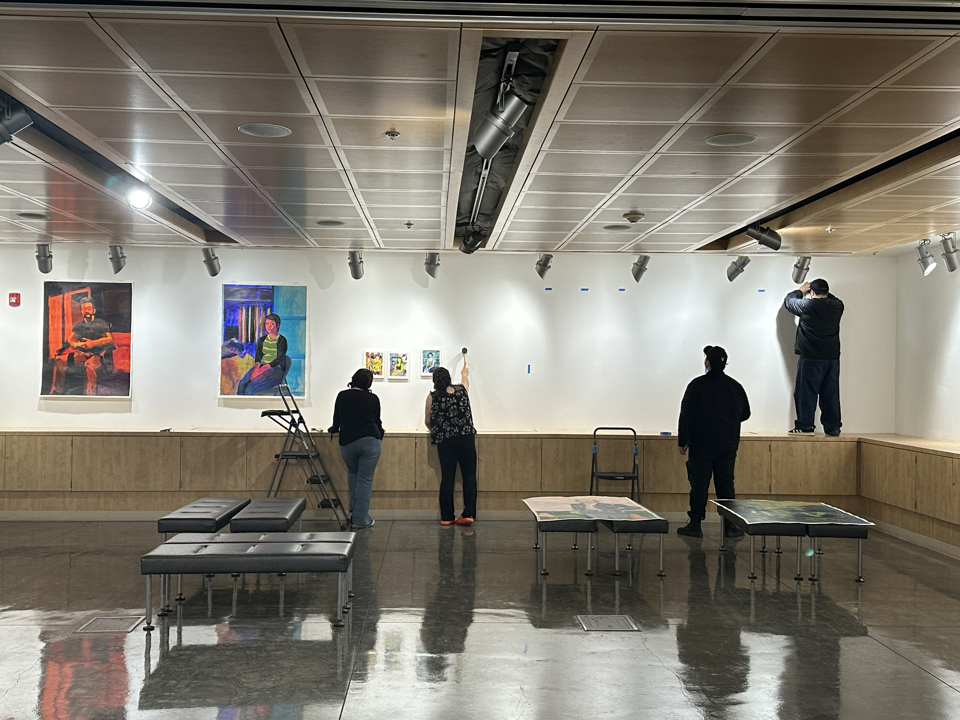 Artist Cynthia Luján with three Norco College student workers/gallery assistants
