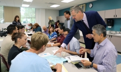 Norco College VP of Academic Affairs Dr. Samuel Lee helping faculty