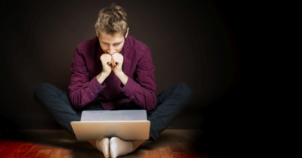 Student looking down at laptop